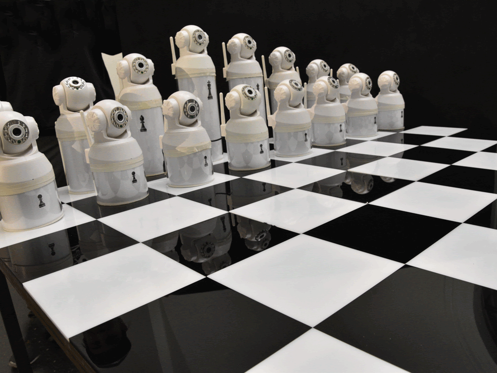 Democratic Chess — camera figures on a chessboard